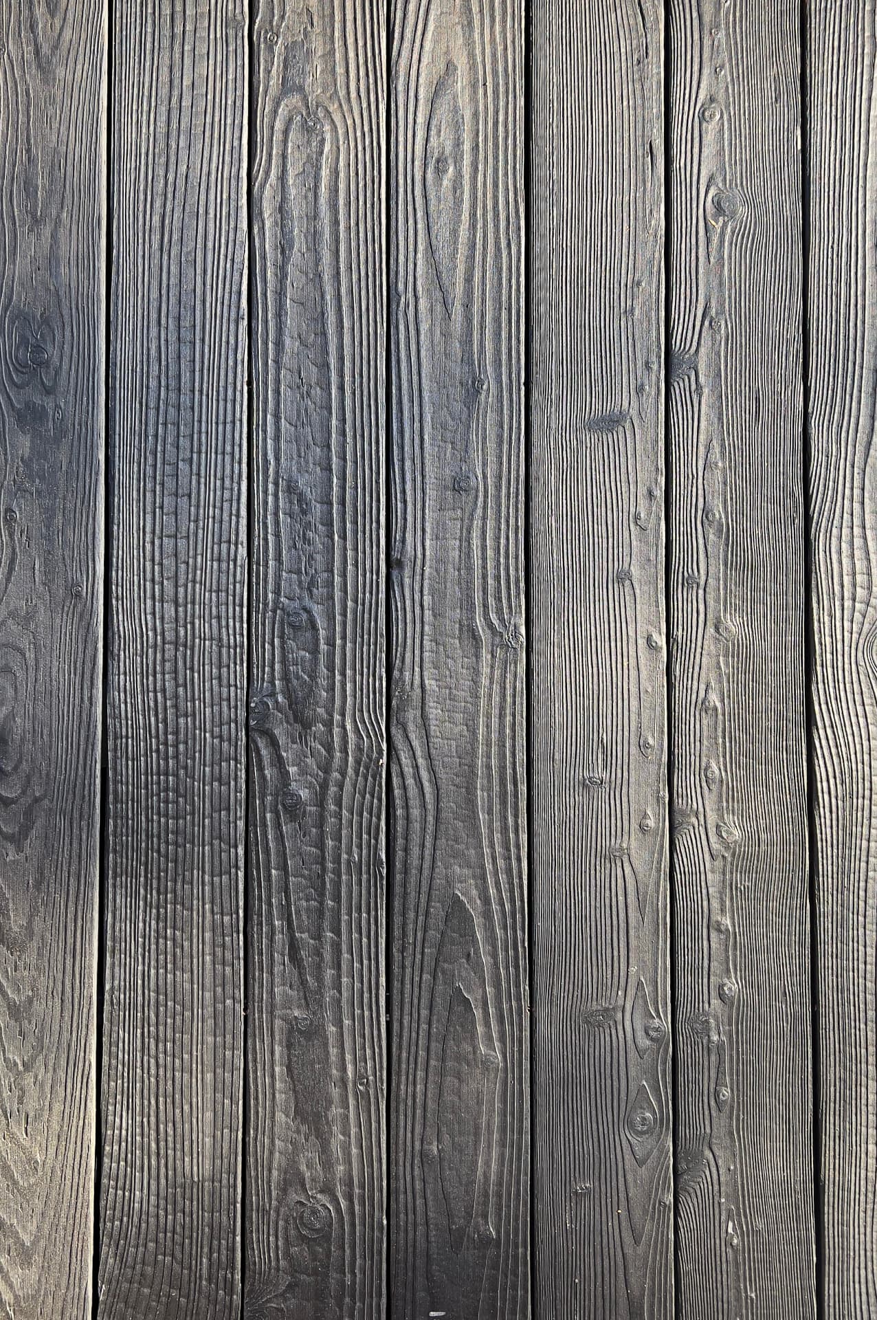 Close-up of KIME Black charred and brushed larch