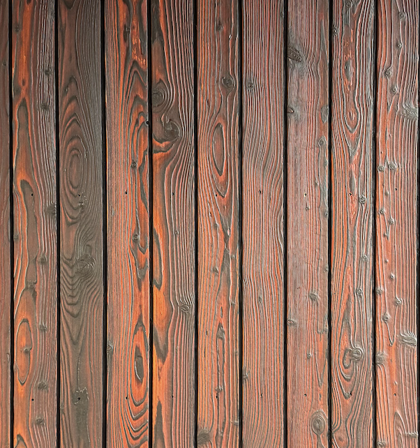 Close-up of KIME Mahogany charred and brushed larch