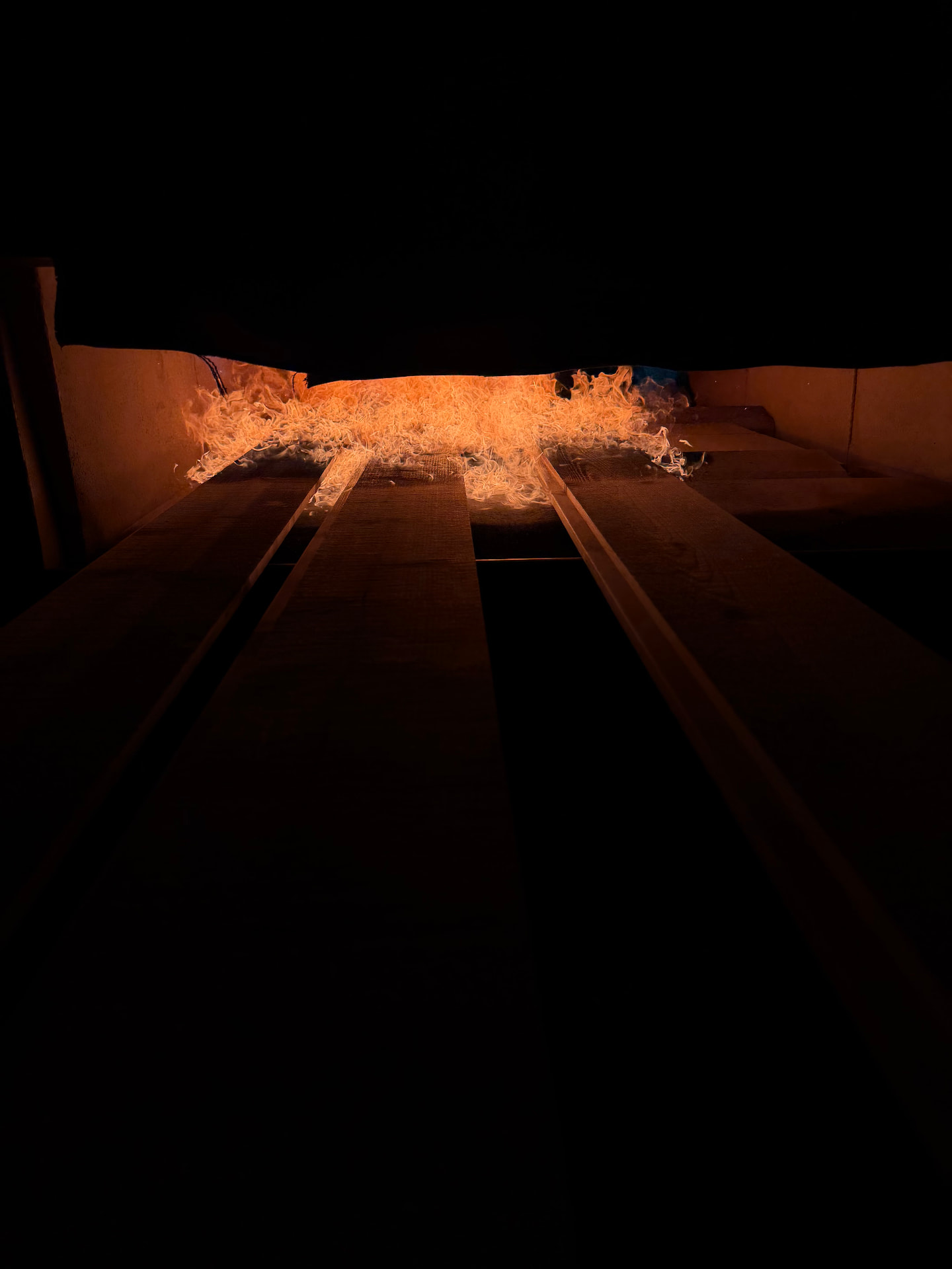 Embers glowing inside the charring chamber