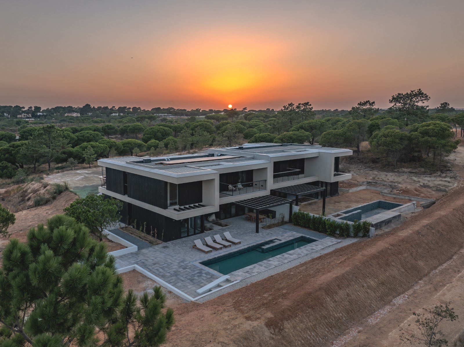 Contemporary Algarve villa clad in KIME Black charred larch at sunset